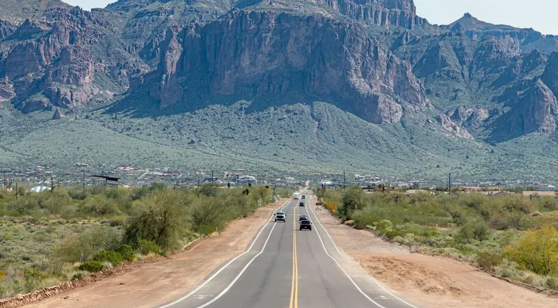 The paved Apache Trail scenic drive leading toward the Superstition Mountains