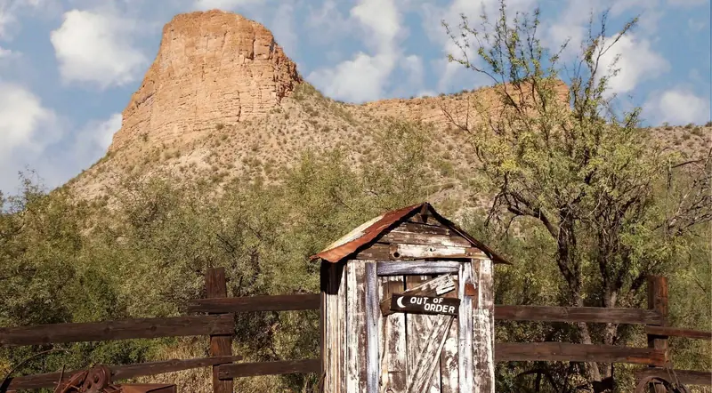 An old wooden outhouse at a historic ghost town along the Apache Trail
