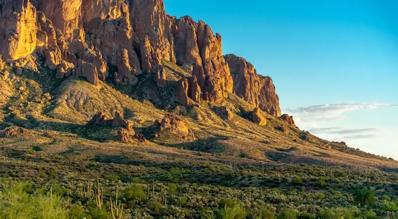Close view of the Superstition Mountains' jagged peaks at golden hour